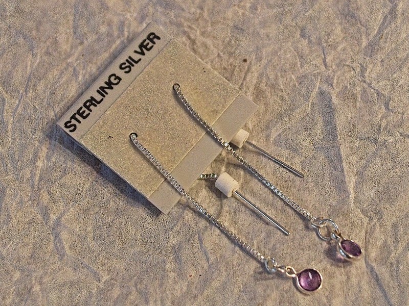 image of small amethyst attached to a sterling silver chain ear finding