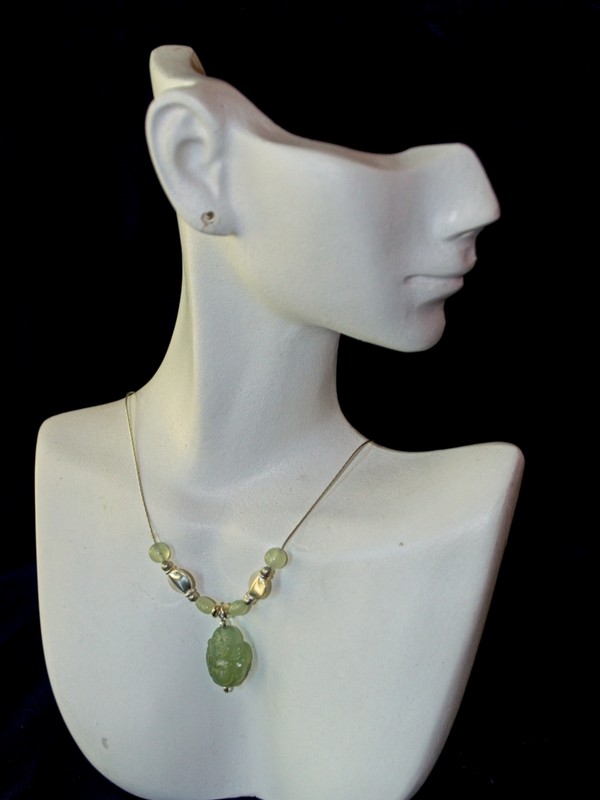 picture of sterling silver choker featuring a carved serpentine buddha