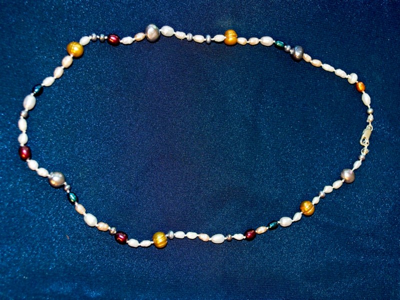 image of necklace made of various colors and shapes of freshwater pearls