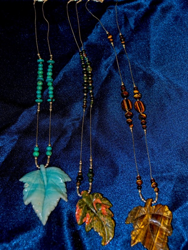 picture of sterling silver and semi-precious stone necklaces featuring carved stone leaf pendants