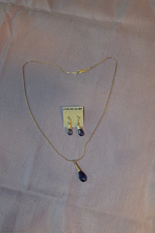 faceted blue iolite teardrop beads topped with sterling silver cones make up this 3 piece set
