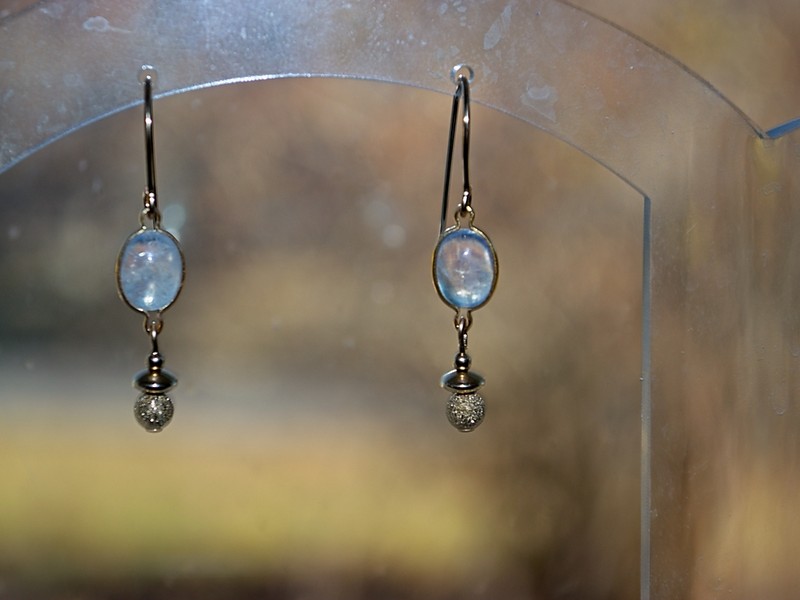 rainbow moonstone cabachons are beautifully complimented by stardust finished gold-filled beads in these semi-precious and gold-filled earrings